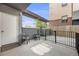 Relaxing outdoor patio with two chairs, privacy fence, and potential for outdoor entertaining at 2922 W 26Th Ave # 1, Denver, CO 80211