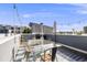 Inviting rooftop patio with a dining table, grill, and picturesque city views at 2922 W 26Th Ave # 1, Denver, CO 80211