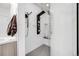 Modern walk-in shower with a sleek black shower panel and a stylish gray tiled floor at 2922 W 26Th Ave # 1, Denver, CO 80211