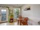 Cozy dining area features a door to the outside, a window, and decorative plants at 1203 6Th St # 1203, Golden, CO 80403