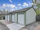 Three-car garage featuring classic white doors with an accent trim, providing ample parking at 1203 6Th St # 1203, Golden, CO 80403