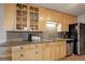 Kitchen with stainless steel appliances and wooden cabinets at 1203 6Th St # 1203, Golden, CO 80403