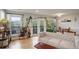 Bright living room featuring hardwood floors, plants, and a balcony access at 1203 6Th St # 1203, Golden, CO 80403