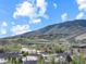 Breathtaking mountain views complement this cozy community under a bright, cloud-filled sky at 1203 6Th St # 1203, Golden, CO 80403