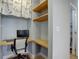 Home office includes built-in shelving, a desk, and a comfortable office chair at 1203 6Th St # 1203, Golden, CO 80403