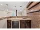 Wet bar area with granite countertop, tile backsplash, and beverage cooler at 22898 Addington Pl, Parker, CO 80138