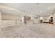 Spacious finished basement with carpet, bar area, and plenty of room for entertaining at 22898 Addington Pl, Parker, CO 80138