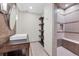 Elegant bathroom with tile shower, floating sink, and stylish modern fixtures at 22898 Addington Pl, Parker, CO 80138