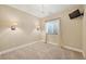 Bright bedroom features carpet flooring, window with blinds, and mounted television at 22898 Addington Pl, Parker, CO 80138
