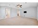 Large bonus room with neutral carpet and light gray walls with views to the hallway and stairwell at 22898 Addington Pl, Parker, CO 80138