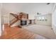 Inviting living room featuring a stone fireplace, carpeted floors, and large windows at 22898 Addington Pl, Parker, CO 80138
