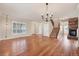 Spacious living room boasting hardwood floors, a stone fireplace, and a staircase at 22898 Addington Pl, Parker, CO 80138