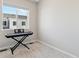 Bedroom with keyboard against wall near window with neighborhood view at 1954 S Poplar Ct, Denver, CO 80224