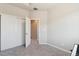 Bedroom features neutral walls, carpeted floor, and a closet for ample storage at 1954 S Poplar Ct, Denver, CO 80224