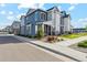 Beautiful two-story exterior elevation view of a home, with landscaped yard and visible street at 1954 S Poplar Ct, Denver, CO 80224