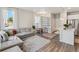 Bright living room with hard wood floors, neutral-toned decor, and modern furnishings at 1954 S Poplar Ct, Denver, CO 80224