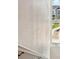 Stairwell featuring white rail and a window view to neighborhood at 1954 S Poplar Ct, Denver, CO 80224