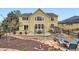 Landscaped backyard with patio, stone accents, garden beds, and mature trees at 22991 Hope Dale Ave, Parker, CO 80138
