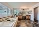 Luxurious bathroom with a soaking tub, double vanity, and elegant tile flooring at 22991 Hope Dale Ave, Parker, CO 80138