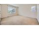 Spacious bedroom with neutral carpet, large windows, and ample natural light at 22991 Hope Dale Ave, Parker, CO 80138