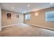 A carpeted bedroom with recessed lighting and two windows for natural light at 22991 Hope Dale Ave, Parker, CO 80138