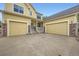 Two-story home with a large driveway and a spacious three-car garage at 22991 Hope Dale Ave, Parker, CO 80138