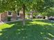 Inviting front yard showcases a well-kept lawn, mature trees and meticulous landscaping at 22991 Hope Dale Ave, Parker, CO 80138