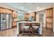 Charming kitchen with stainless appliances, a center island, and hardwood flooring at 22991 Hope Dale Ave, Parker, CO 80138