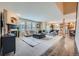 Bright living room featuring a fireplace, open floor plan, and lots of natural light at 22991 Hope Dale Ave, Parker, CO 80138