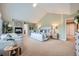 Bright and airy main bedroom with a fireplace, comfortable seating, and stylish decor at 22991 Hope Dale Ave, Parker, CO 80138