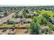 Aerial view of a fenced backyard with a playset and a home with solar panels on the roof at 5183 Durham Ct, Denver, CO 80239