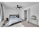 Spacious bedroom with ceiling fan and gray headboard at 5183 Durham Ct, Denver, CO 80239