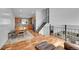 Open concept living area featuring a dining table, a kitchen with wooden cabinetry, and a staircase at 5183 Durham Ct, Denver, CO 80239