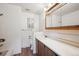 Clean bathroom with white tile, a vanity with mirror, and a bathtub at 11143 W Ohio Pl, Lakewood, CO 80226