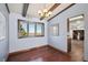 Dining room with hardwood floors and large windows at 11143 W Ohio Pl, Lakewood, CO 80226