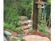 Landscaped garden with stone path and colorful flowers at 11143 W Ohio Pl, Lakewood, CO 80226