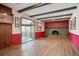 Gathering room with brick fireplace and hardwood floors at 11143 W Ohio Pl, Lakewood, CO 80226