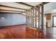 Living room with hardwood floors and wood beam ceiling at 11143 W Ohio Pl, Lakewood, CO 80226