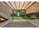 A shaded patio area overlooks the lawn and a shed in the backyard with a garden at 3965 S Fundy Cir, Aurora, CO 80013