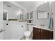 Well-lit bathroom with a modern vanity, storage cabinet, and neutral decor create a clean, inviting space at 3965 S Fundy Cir, Aurora, CO 80013