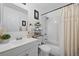 Bathroom featuring a shower over bath and a clean vanity with mirror at 3965 S Fundy Cir, Aurora, CO 80013