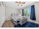 Cozy bedroom featuring a comfortable bed, a soft rug, and an abundance of natural light at 3965 S Fundy Cir, Aurora, CO 80013