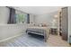 Cozy bedroom featuring a comfortable bed, a soft rug, and an abundance of natural light at 3965 S Fundy Cir, Aurora, CO 80013
