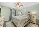 Charming bedroom with a comfortable queen bed, soft rug, and abundant natural light at 3965 S Fundy Cir, Aurora, CO 80013