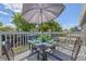 Outdoor dining on the deck with green accents, offering a delightful space for al fresco meals at 3965 S Fundy Cir, Aurora, CO 80013