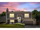 Charming two-story home featuring a well-manicured lawn, flower beds, and a lovely entry way at 3965 S Fundy Cir, Aurora, CO 80013