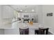 Bright kitchen featuring white cabinets, stainless appliances and granite countertop at 3965 S Fundy Cir, Aurora, CO 80013