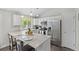 Bright kitchen featuring white cabinets, stainless appliances and granite countertop at 3965 S Fundy Cir, Aurora, CO 80013