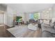 Inviting living room featuring a plush gray sectional sofa and modern decor at 3965 S Fundy Cir, Aurora, CO 80013
