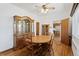 Dining room with hardwood floors and a classic wooden dining set, perfect for Gathering gatherings at 5960 Glencoe St, Commerce City, CO 80022